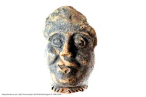 Museo archeologico del Compito: frammento di terracotta raffigurate una testina romana con monile celtico (torques) Archivio SAER